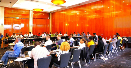 consortium members around a table